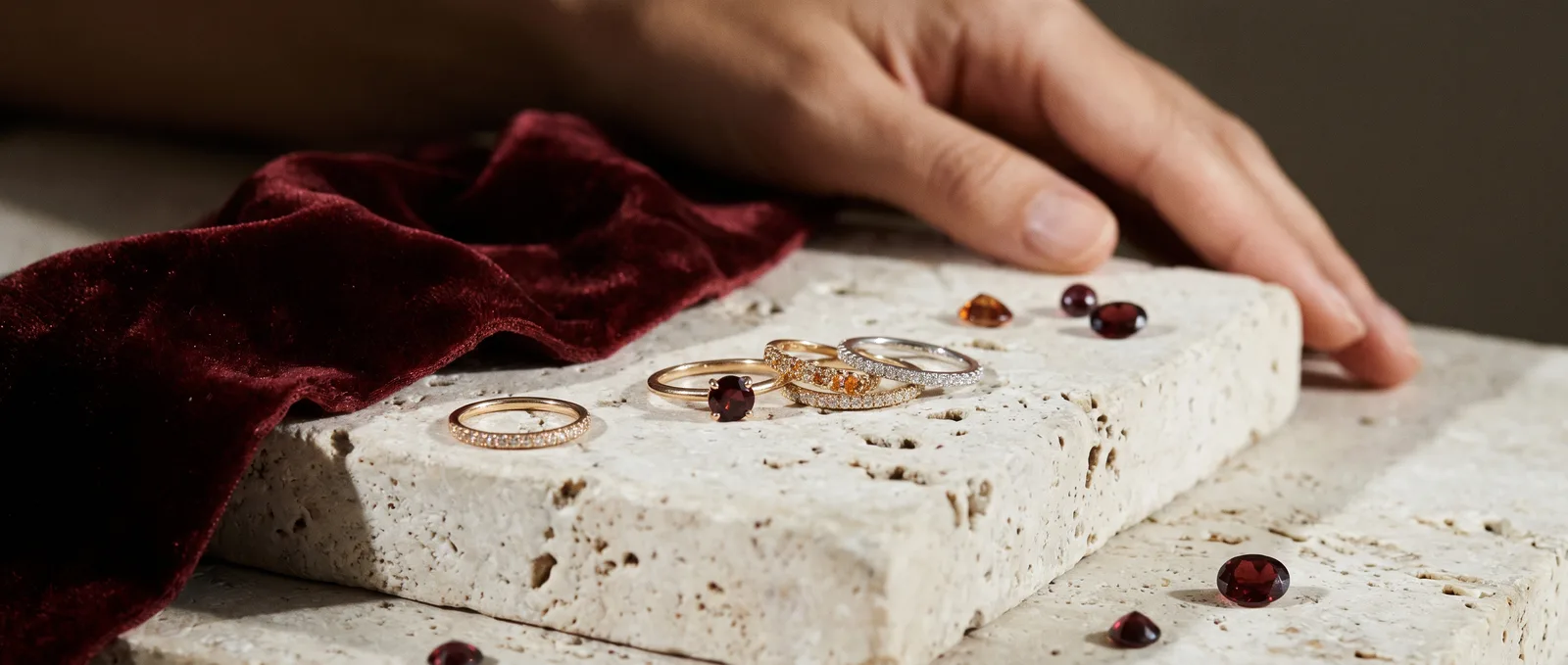 Rings arranged on a pale stone plinth
