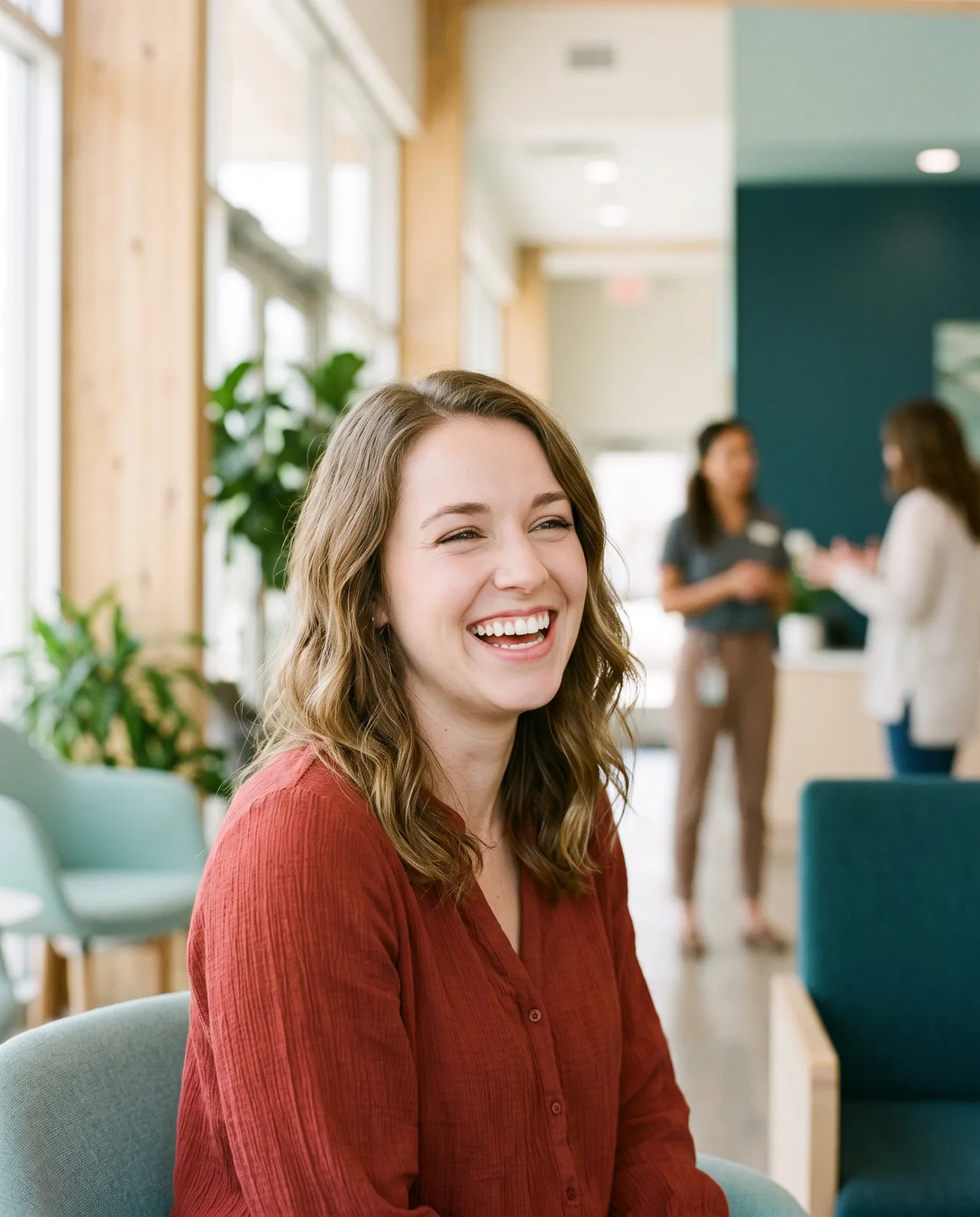 Smiling woman after clear aligner treatment