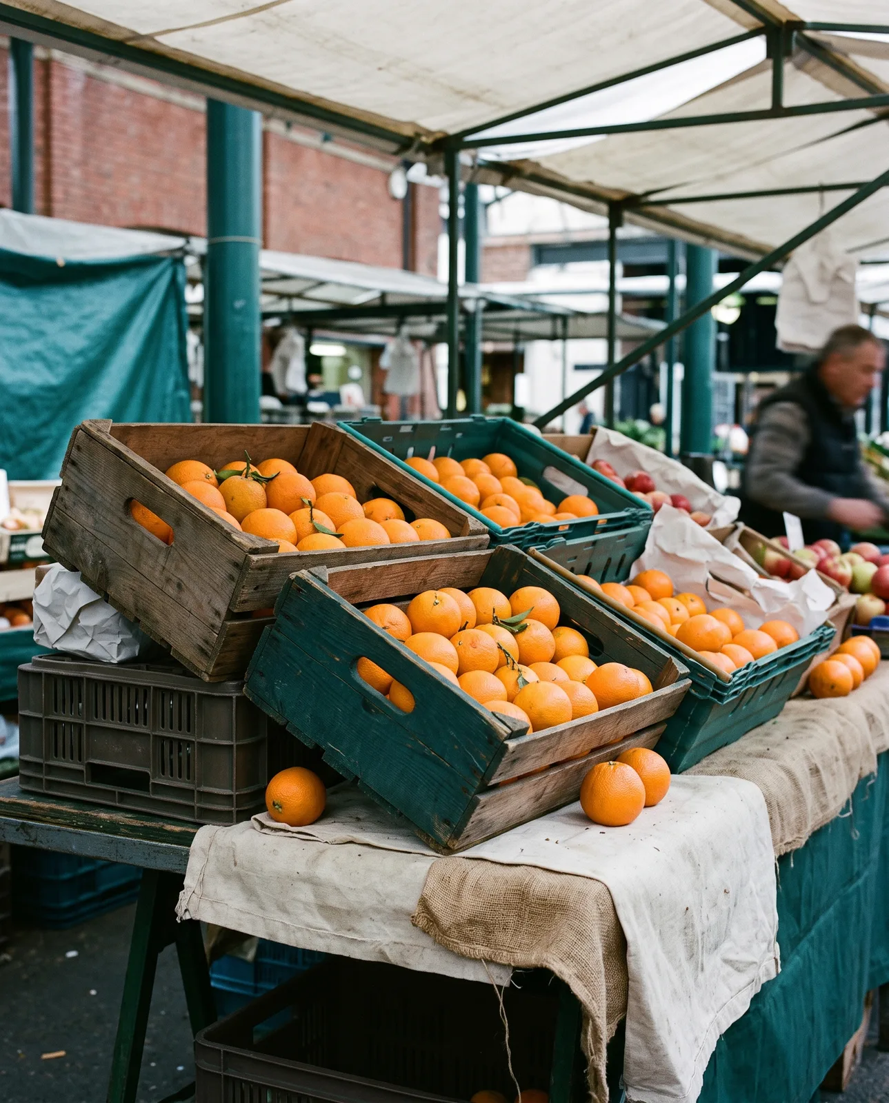 Market stall with crates of oranges